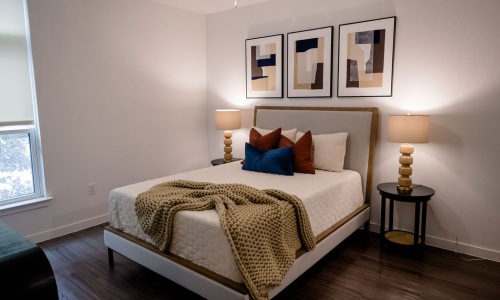Bedroom options to fit every lifestyle a bedroom with a bed and lamps