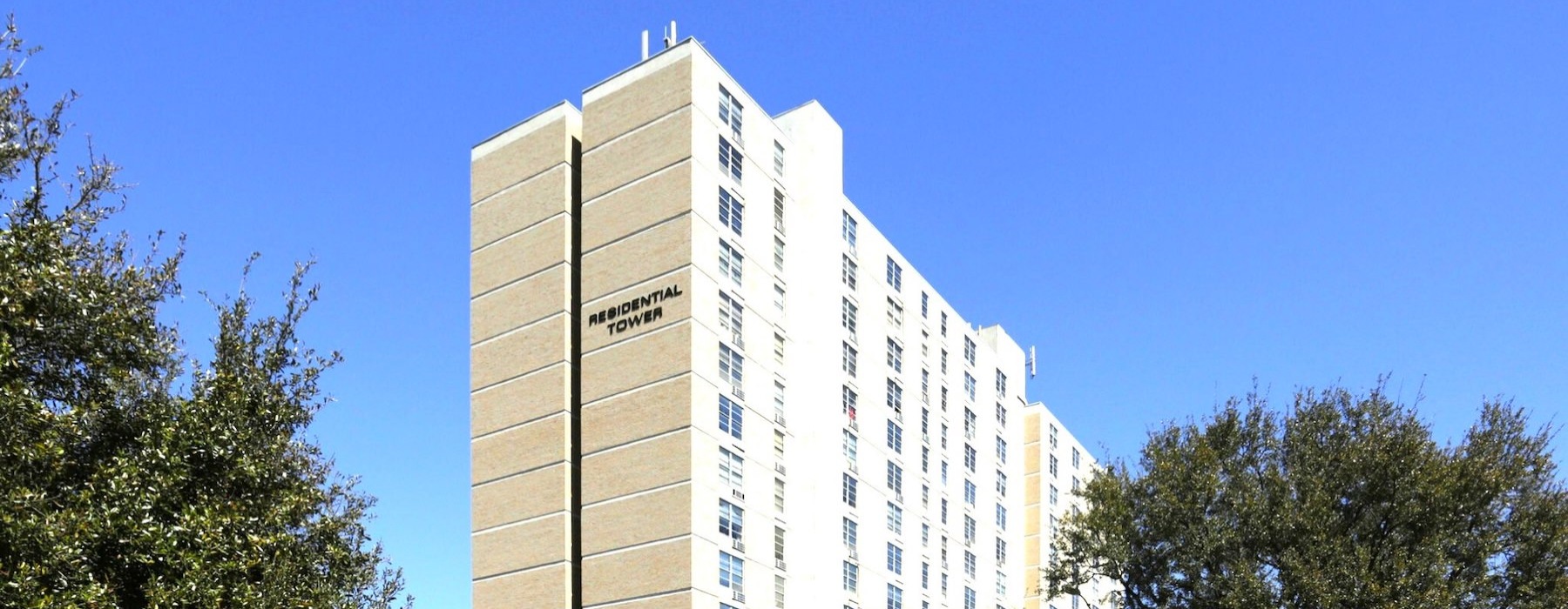 a high rise building with a sign on it